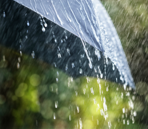Rain falling off an umbrella.
